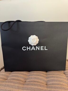 CHANEL Black Paper Shopping Bag with White Camellia